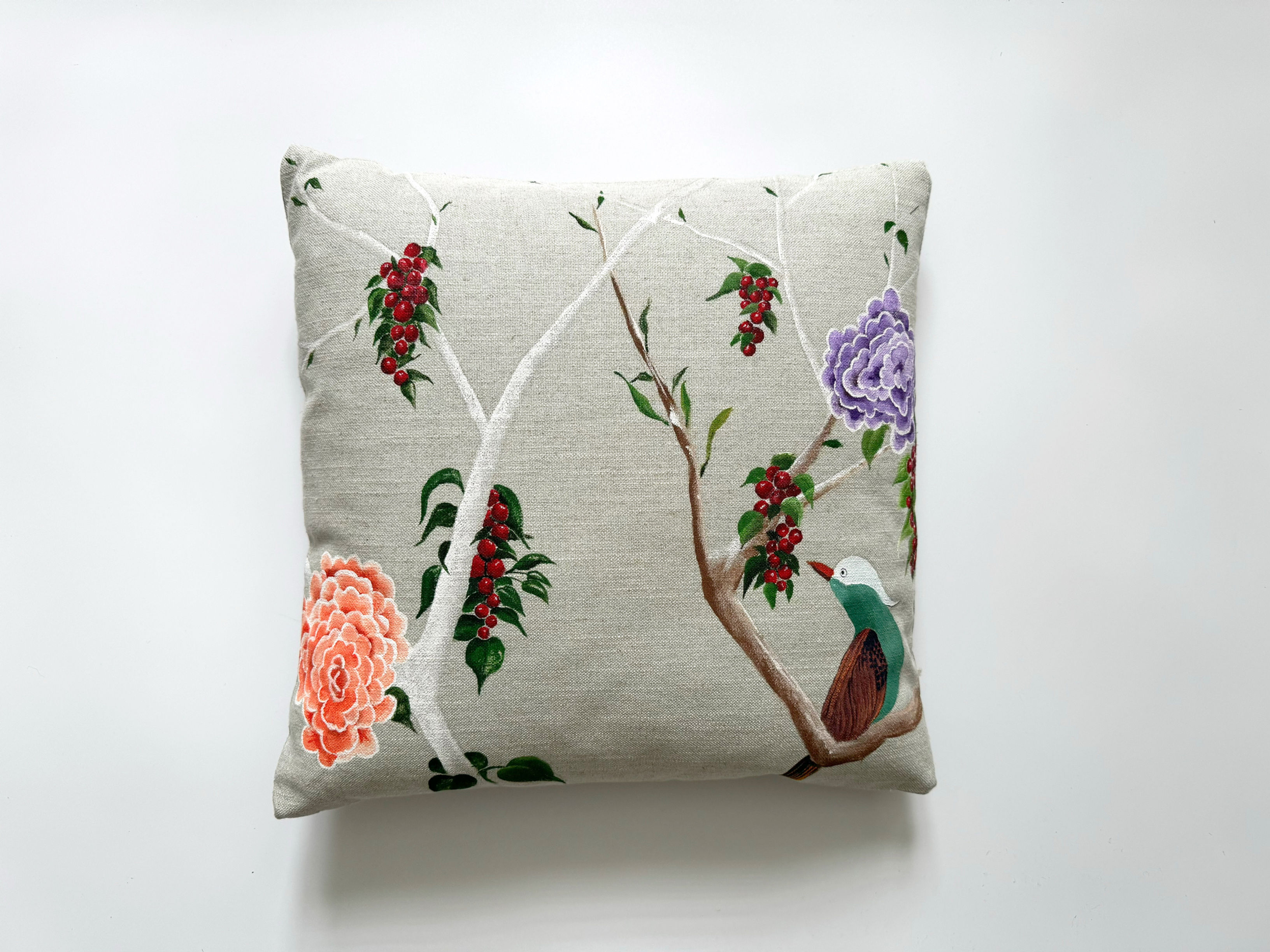 hand-painted cushion with bird and floral design