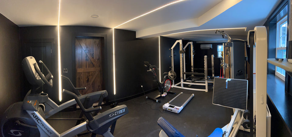 Residential home gym remodel lit with modern LED track lighting installed by In Power Electric.