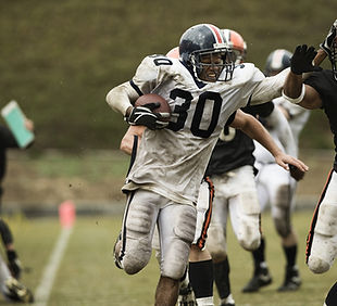 Running Back Carrying Ball