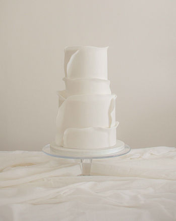 Two-tier contemporary wedding cake with soft fondant-wrapped panels by Copper Rose, created for a stylish US destination wedding at Gleneagles, Scotland.
