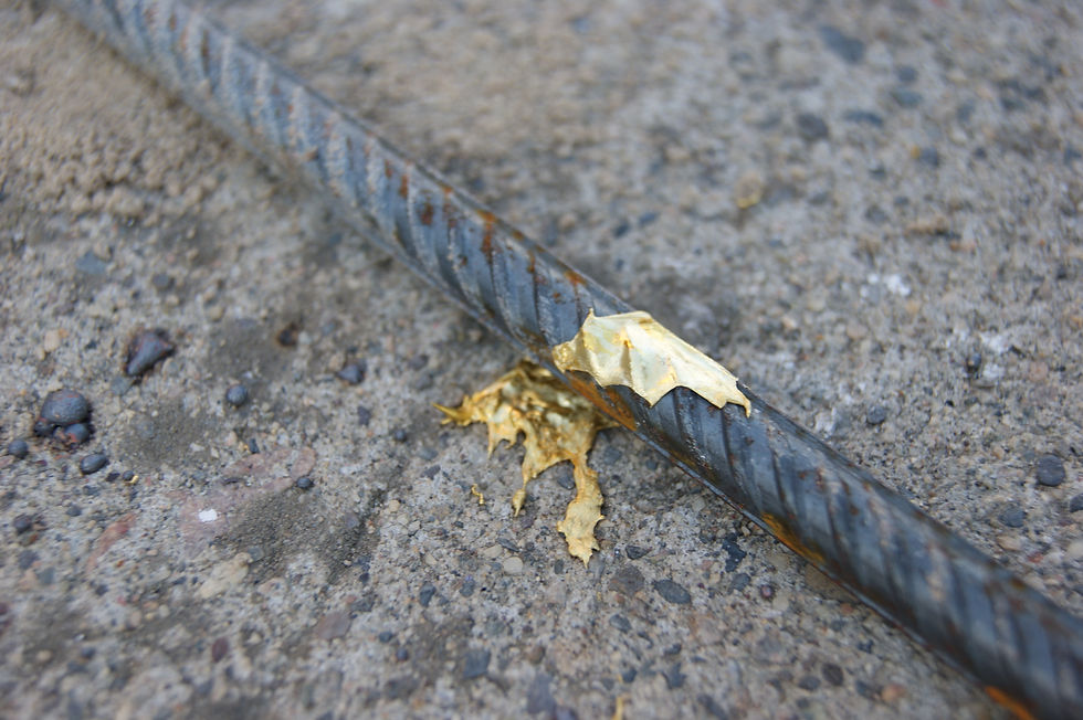 gold metal splashed on rebar