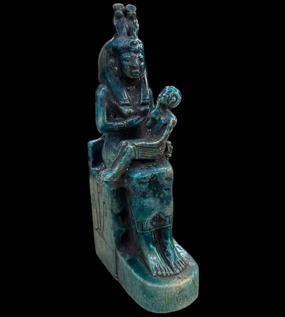 The divine mother nursing the sickly child. These were kept in Kemetic homes.