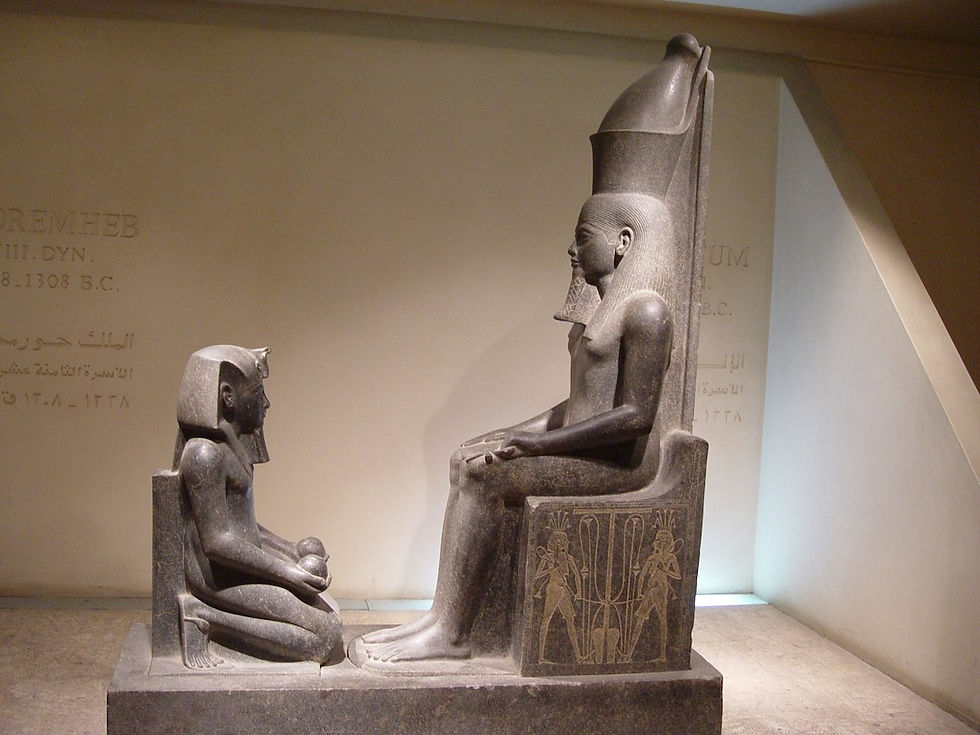Lord Atum on the high seat of the Court of Righteousness. Luxor Museum.