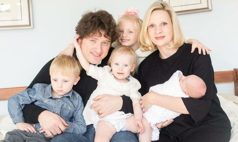 Family of man woman and four children