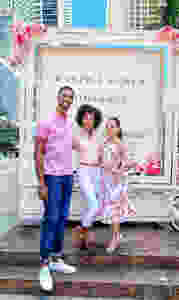 Basketball player Chris Bosh, his wife Adrienne & model Kamla-Kay outside by Ralph Lauren event truck
