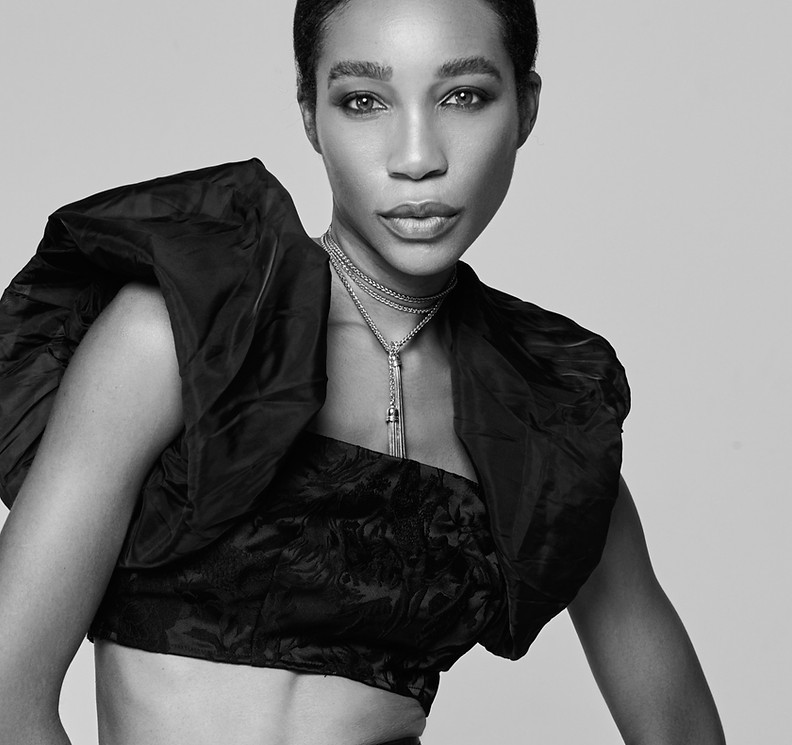 Model & posing coach Kamla-Kay posed looking at camera