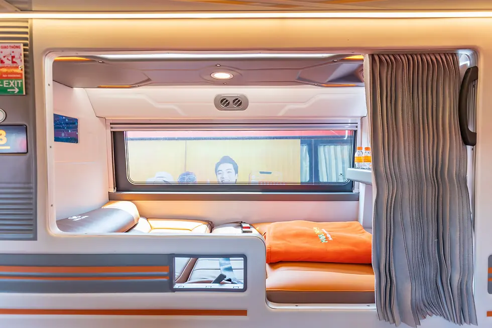 High angle view of a sleeper bus cabin with beds and curtains