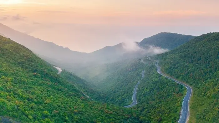Hai Van Pass – a scenic coastal mountain road famous for its winding curves, breathtaking ocean views, and dramatic landscapes between Da Nang and Hue.