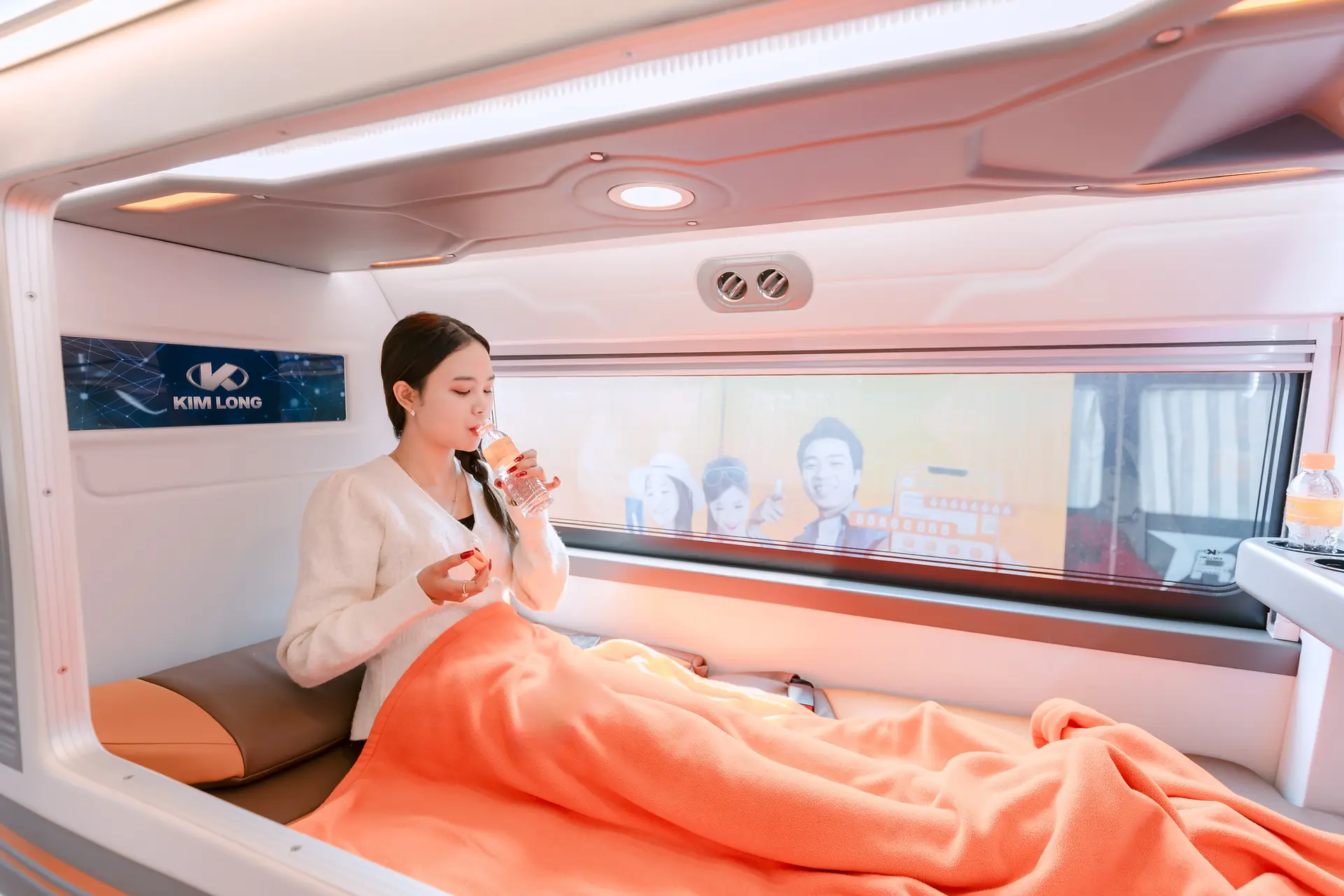 VIP cabin bus interior offering comfortable sleeping pods and onboard conveniences.