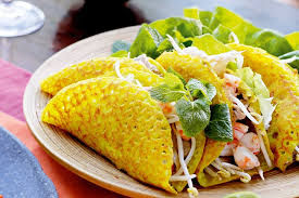 Crispy Banh xeo in Da Nang with shrimp, pork, and fresh herbs