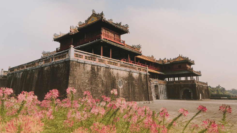Imperial City of Hue – ancient royal architecture with mossy walls and golden roofs, reflecting Vietnam’s last dynasty’s history.