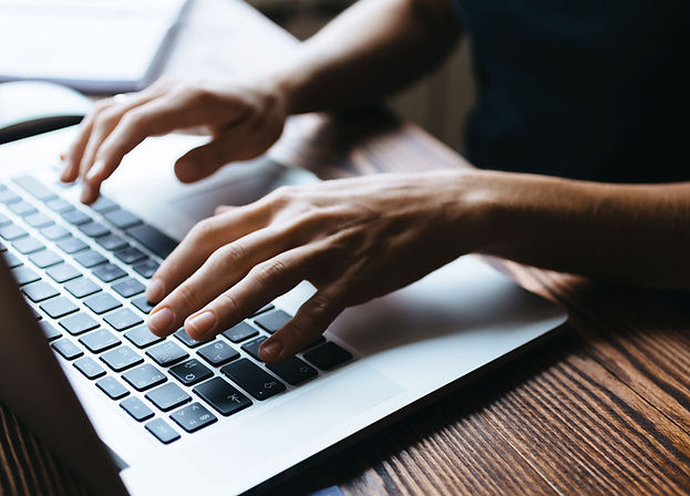 Typing on a laptop