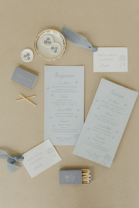 wedding menus show forget-me-nots and calligraphy