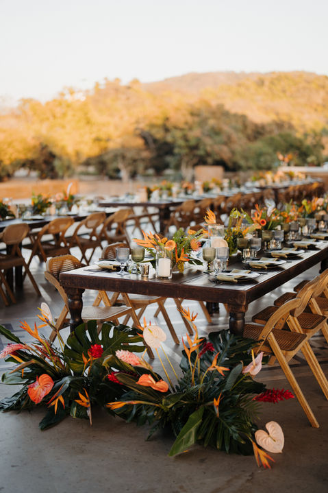 wedding with an amazing guest experience in mexico featured long tables with beautiful candles and florals