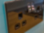 Close-up photo of an electrical plug socket.jpg