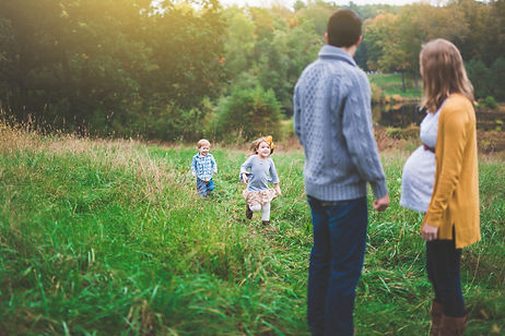 unposed outdoor family session in a field in Concord MA