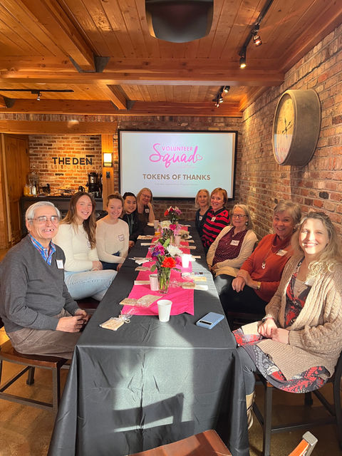 volunteer squad sitting at a dinner