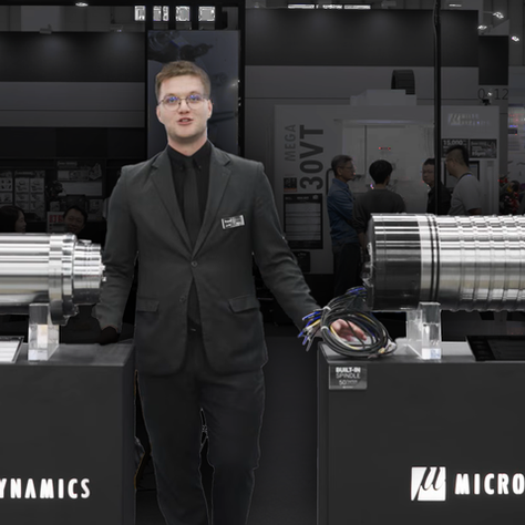 A man showing the difference between a 40 taper and 50 taper built-in cnc spindle MicroDynamics