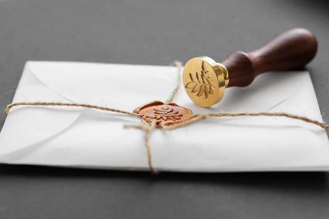 notary-public-wax-stamper-white-envelope-with-brown-wax-seal-golden-stamp-responsive-desig