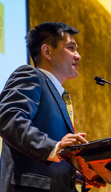 A business owner speaking at a conference