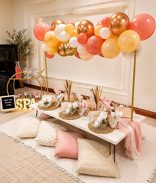 Luxury kids spa party and pamper party by Katie's Party Lab featuring a custom spa tablescape with personalized guest stations, facial treatment supplies, floor seating, blush pink textiles, gold accents, and an organic balloon installation. Perfcet for girls birthdays, tween spa parties, self-cre themed cleebrations, slumber party add-ons, and boutique children's events in Erie, Colorado, Boulder County, and the Denver metro area.