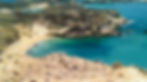View of a secluded and sandy beach on Koufonissi isle, from the surrounding hill. The beach is accessible only by boat and is located at the southwest part of the isle
