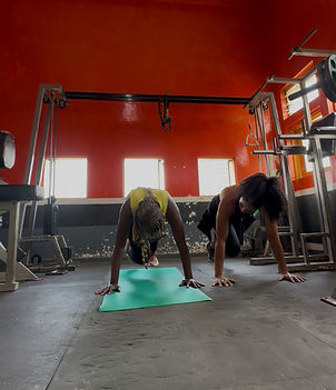 a client and personal training coach doing mountain climbers in kenya