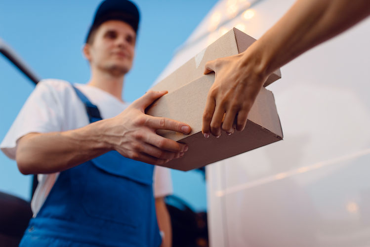 deliveryman-uniform-gives-parcel-female-recipient-car-delivery-service-man-holding-cardboa