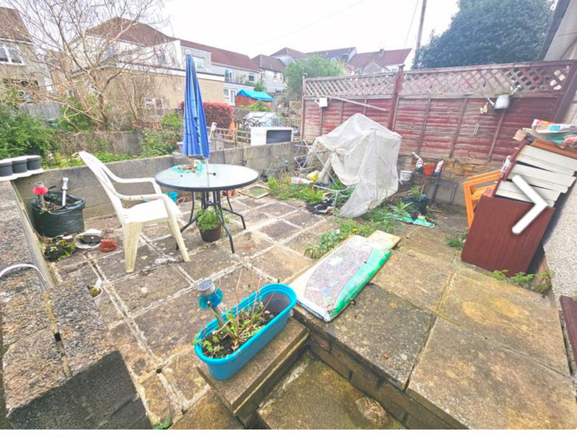 Back garden patio area with table and chairs