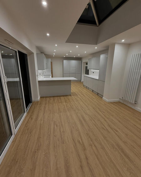 Modern kitchen extension with light oak flooring