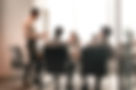 Colleagues-having-meeting-in-boardroom,-businessman-giving-speech,-blurred-photo-132527622