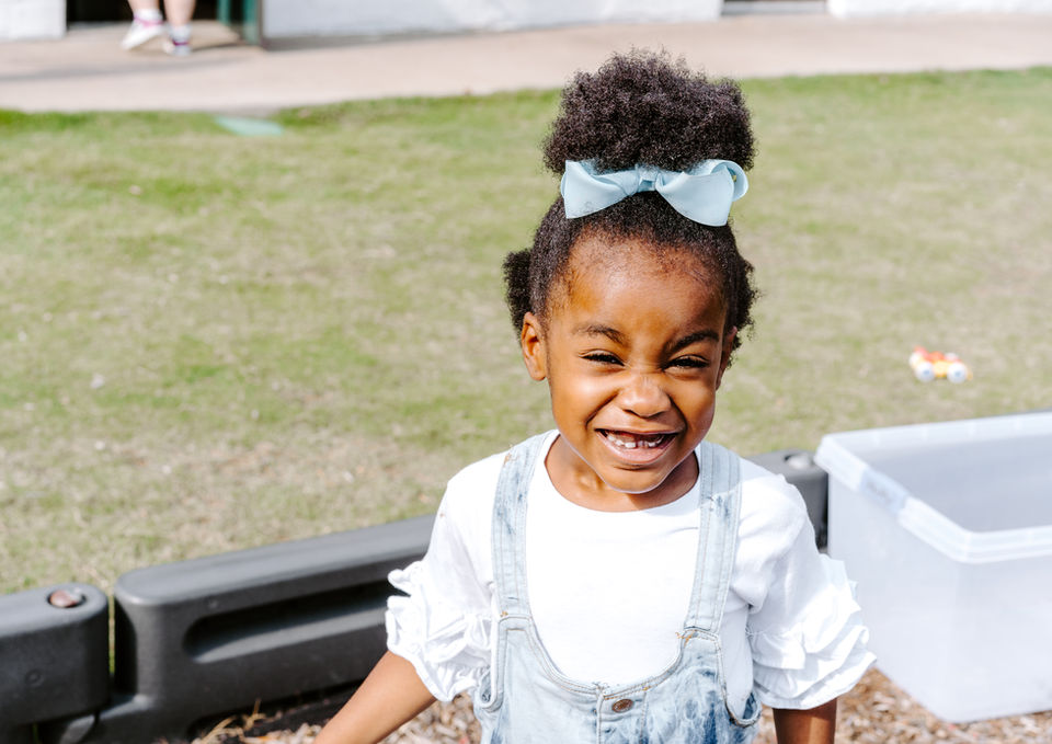 Close-up of a Child Smiling During a Crafts Session