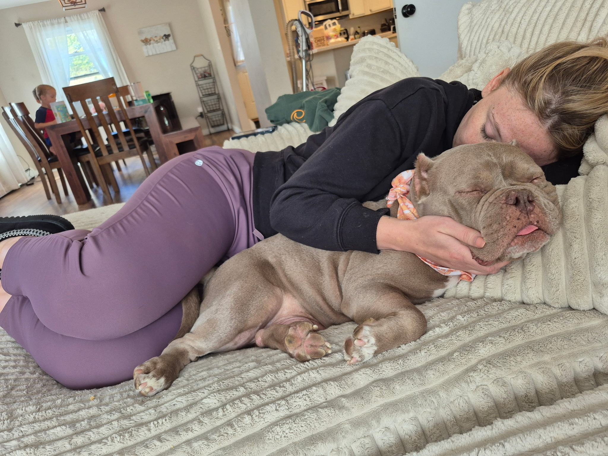 A foster sharing a quiet moment at home with a rescue dog