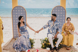 Indian wedding couple seated on Haldi ceremony stage at Grand Palladium Costa Mujeres Cancun