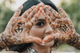 close up of Indian bride Mehndi henna designs during Mehndi ceremony in Cancun Mexico