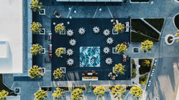 Aerial top-down view of the Garba and Sangeet setup with a tropical dance floor at TRS Coral Hotel Costa Mujeres