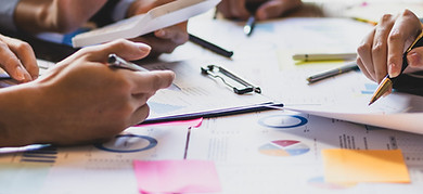 People going through paperwork together