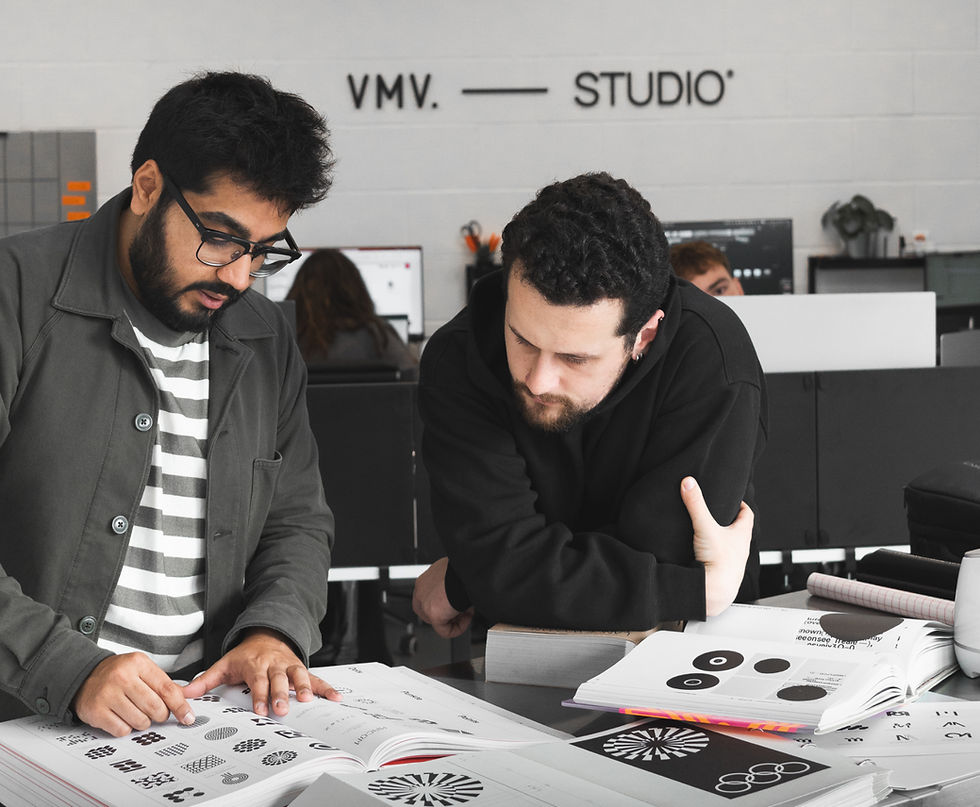 two employees at VMV.STUDIO looking at brand design