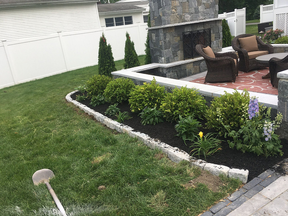 The Benefits of Including an Outdoor Fireplace in Your Paver Patio Design in Weston, MA