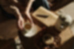 person-enjoying-tea-on-wooden-table.jpg