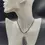 Thumbnail: Black kyanite pendant with adjustable wax cord displayed on female mannequin.