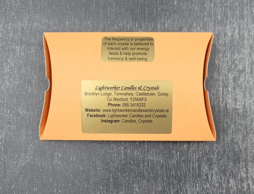 Thumbnail: back of the orange pillow box with gold information stickers.