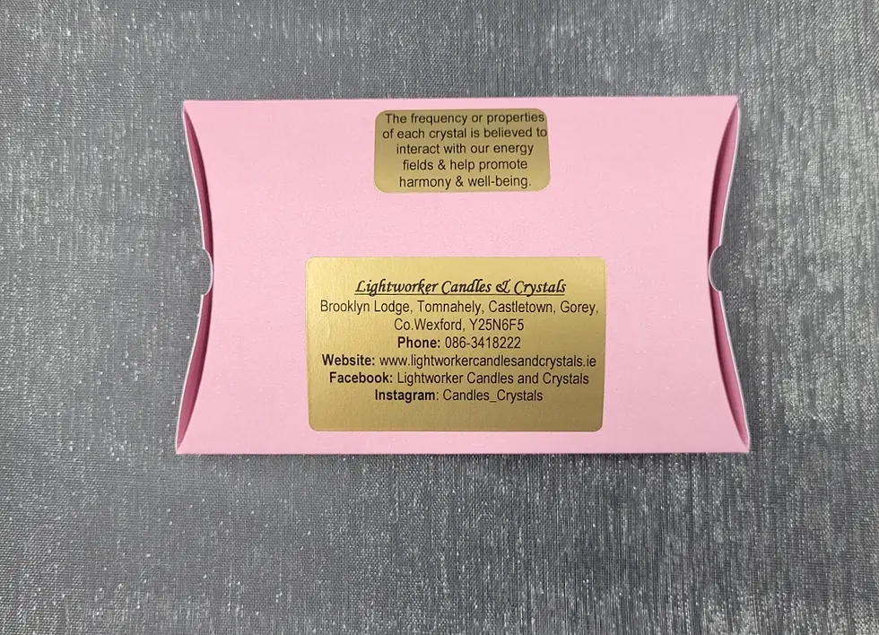 Thumbnail: back of pink pillow box with gold information stickers.
