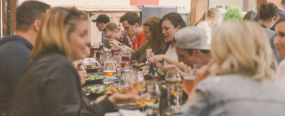 People eating a meal around a table_edited_edited.jpg