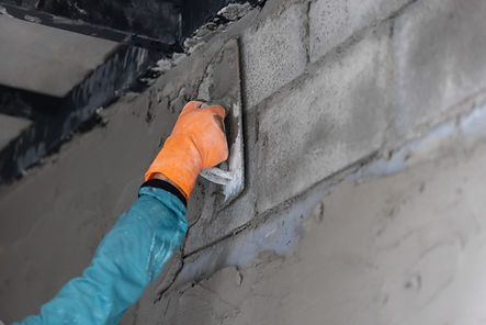 construction-worker-plastering-wall-surface-min-scaled.jpg