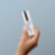Bottle with Woman Hand Mockup kopiera.jpg