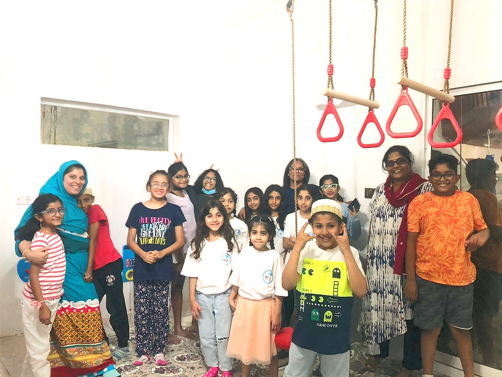 Students and teachers in a group at The Blue Umbrella skills center
