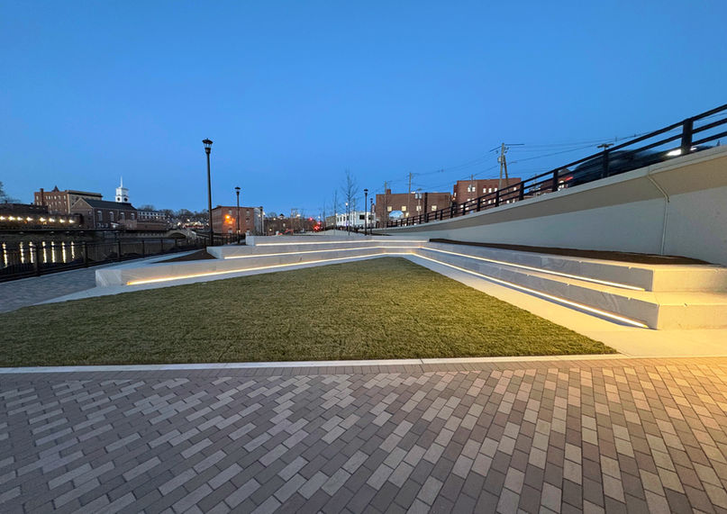 Custom outdoor architectural lighting installed in public park terraced seating.