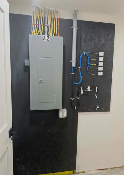 Clean residential electrical service panel upgrade featuring meticulously organized wire management.