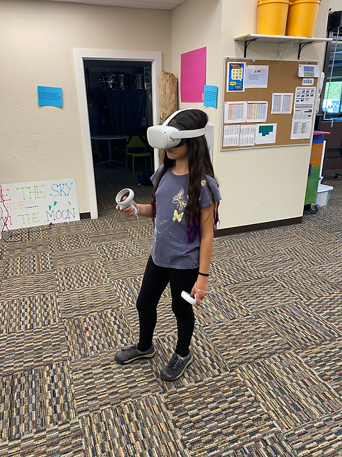 Photo of TVS student playing a virtual reality game during Video Game Club.